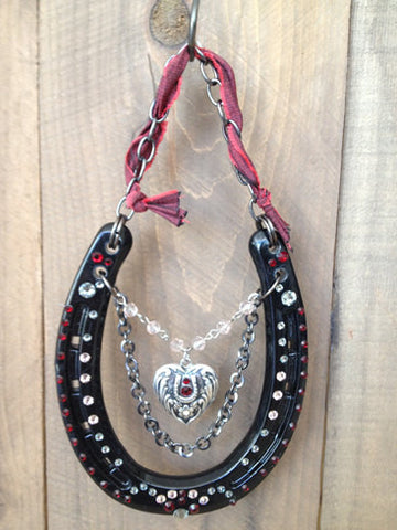 Luck Adorned Lucky Heart Lucky Horseshoe Lucky Heart is a shiny, gloss black shoe that features a vintage heart pendant, antique chains and lots of sparkly Swarovski Crystals in ruby and white diamond.
